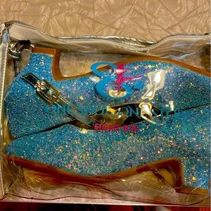 Blue sparkly Mary Jane’s with a 1’ heel and a flower on the clasp